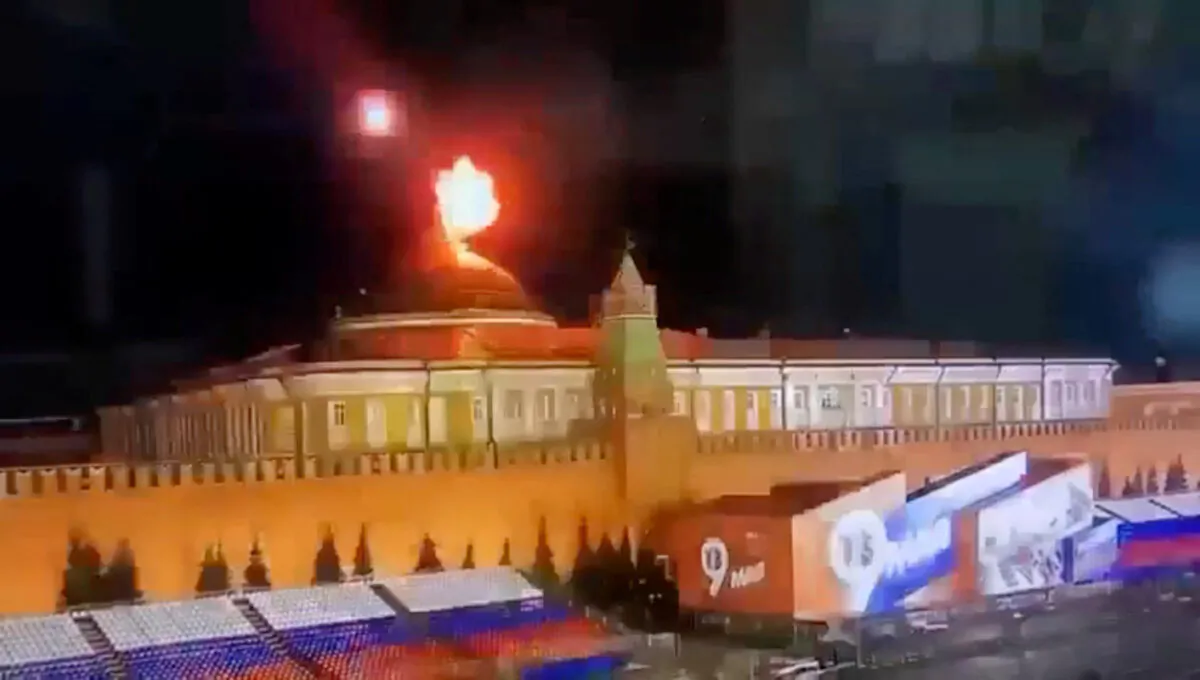 A still image taken from video shows a flying object exploding in an intense burst of light near the dome of the Kremlin Senate building during the alleged Ukrainian drone attack in Moscow, Russia, on May 3, 2023. (Ostorozhno Novosti/Handout via REUTERS)
