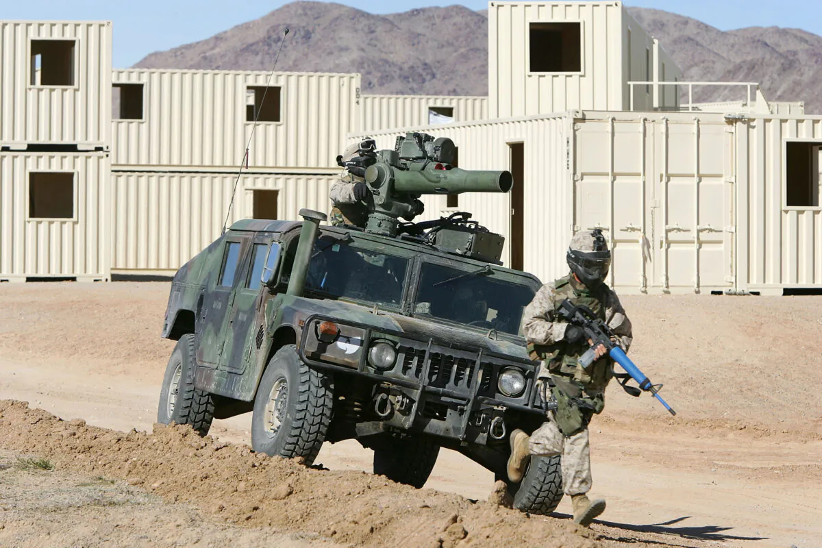 U.S. Marines of the First Expeditionary Force (1MEF) train in an urban combat exercise at Range 200 simulated Iraqi village at the Twentynine Palms Marine Base near Twentynine Palms, Calif., on Nov. 14, 2005. (David McNew/Getty Images)