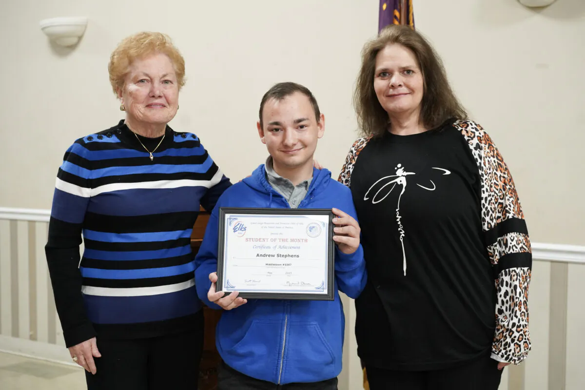 Middletown School District board president Rose Tabiassen (L), Andew Stephens (C), and Elizabeth Deaver at Middletown Elks Lodge #1097 in Middletown, N.Y., on May 3, 2023. (Cara Ding/The Epoch Times)