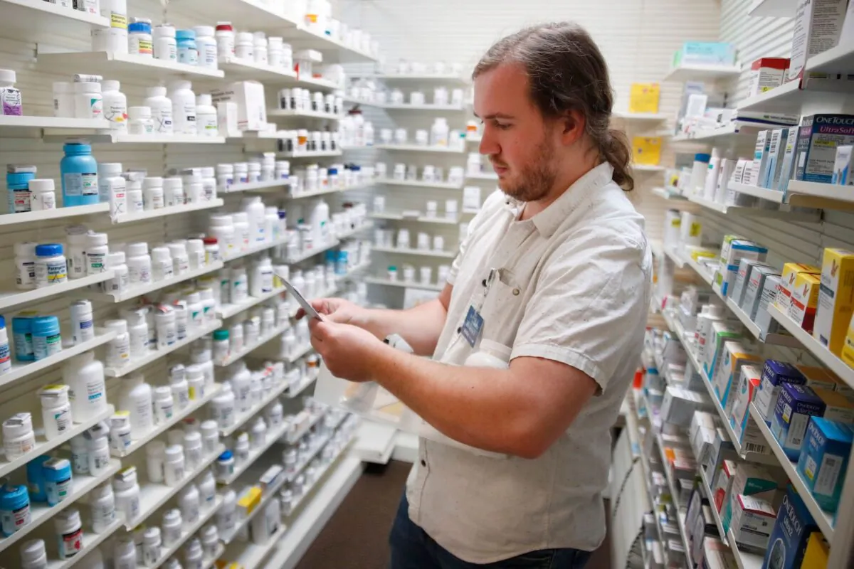 A pharmacy technician fills prescriptions at Rock Canyon Pharmacy in Provo, Utah, on May 20, 2020. (George Frey/AFP via Getty Images)