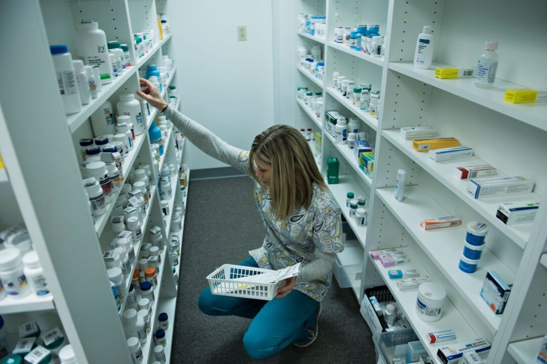 A staff member sorts through drugs drugs while filling a prescription at the Clay-Battelle Community Health Center's pharmacy in Blacksville, W.Va., on March 21, 2017. (Brendan Smialowski/AFP via Getty Images)