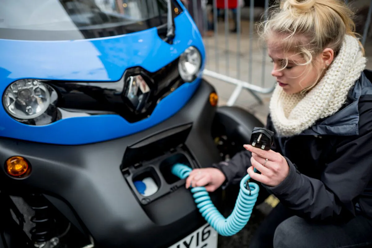 A Renault staff member poses at a promotion event in London on Nov. 4, 2017. (Tolga Akmen/AFP)