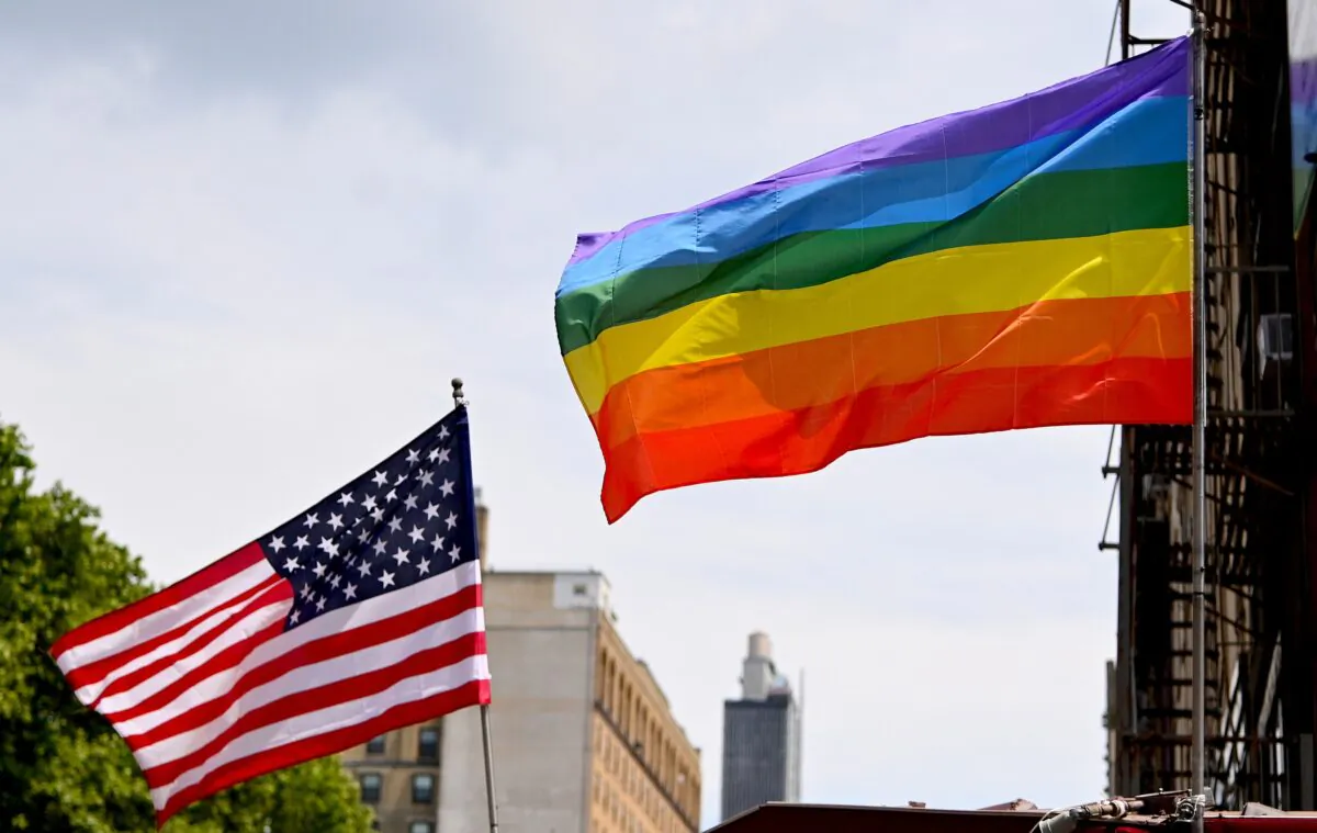 A U.S. flag and Pride flag are flown in Chelsea, New York, on June 20, 2020. (Jamie McCarthy/Getty Images)