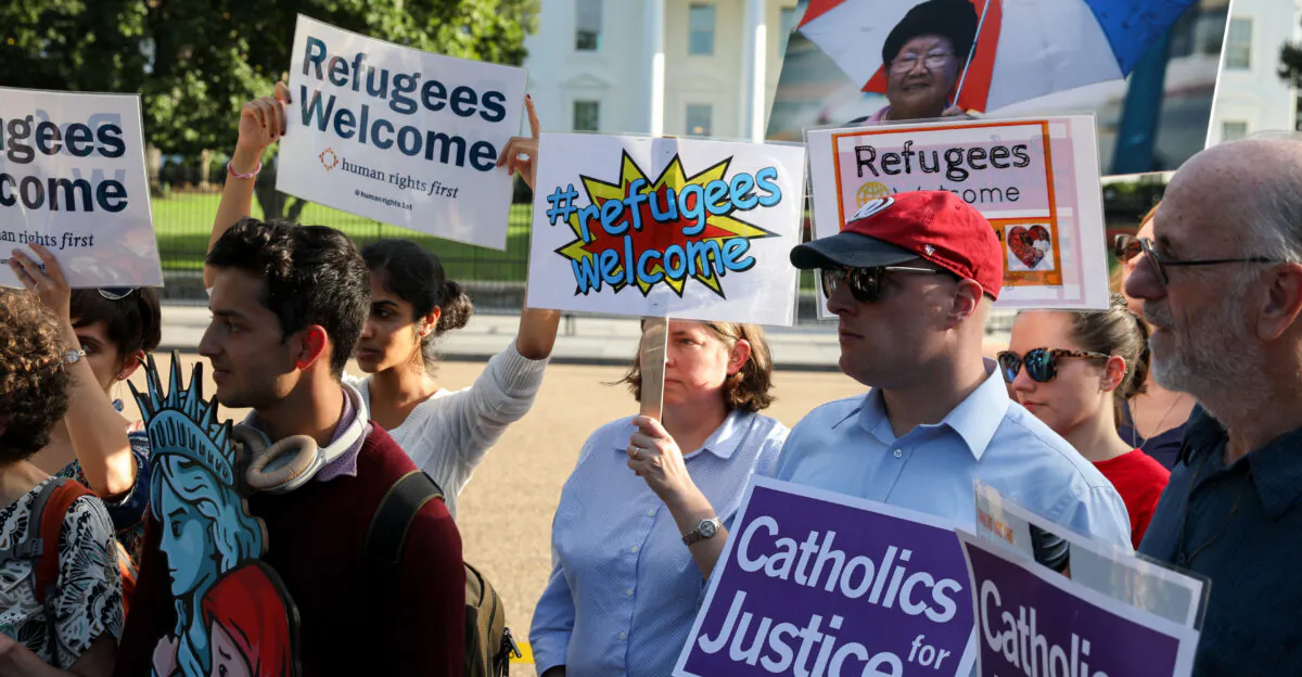Members of nongovernmental organizations gather in front of the White House on Sept. 18, 2018, to protest against then-President Donald Trump’s administration’s announcement that it would limit the number of refugees admitted into the United States in fiscal year 2019. (Yasin Ozturk/Anadolu Agency/Getty Images)