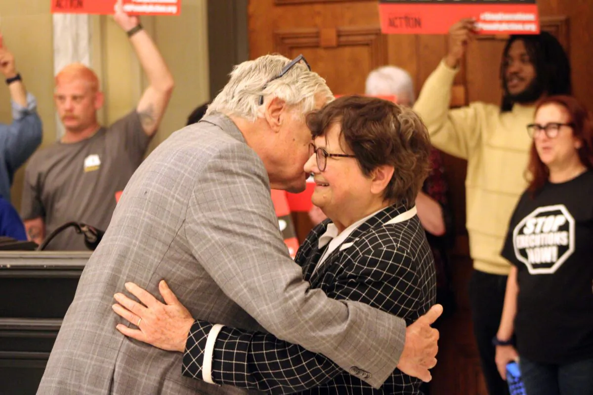 Death penalty abolitionist Sister Helen Prejean is greeted by a supporter during a demonstraiton in the Oklahoma capitol building on May 4, 2023. (Michael Clements/The Epoch Times)