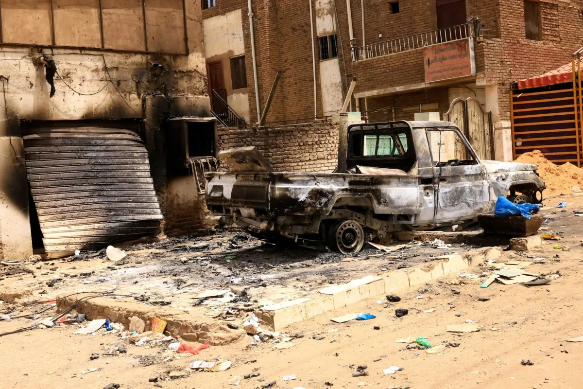 A damaged car and buildings are seen at the central market during clashes between the paramilitary Rapid Support Forces and the army in Khartoum North, Sudan, on April 27, 2023. (Reuters/Mohamed Nureldin Abdallah)