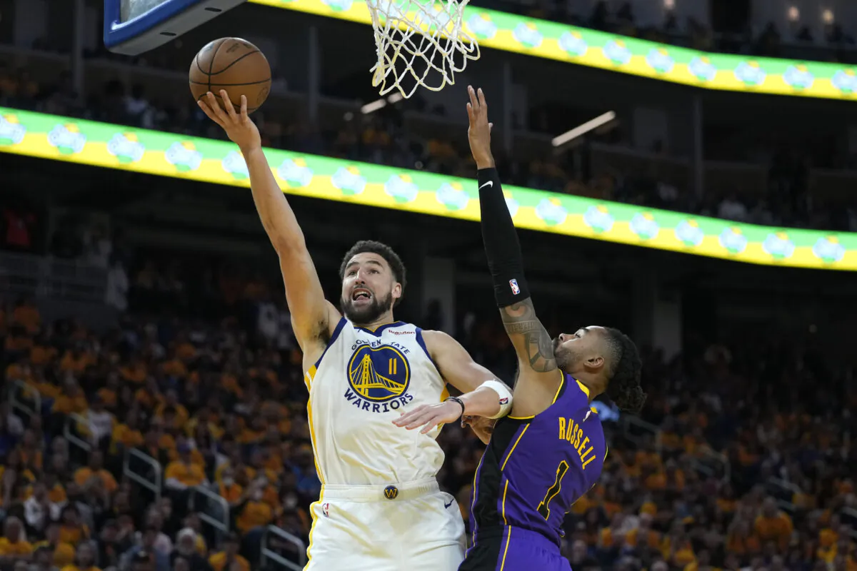 Golden State Warriors guard Klay Thompson (11) shoots against Los Angeles Lakers guard D'Angelo Russell, right, during the second half of Game 2 of an NBA basketball Western Conference semifinal game in San Francisco on May 4, 2023. (Godofredo A. Vasquez/AP Photo)