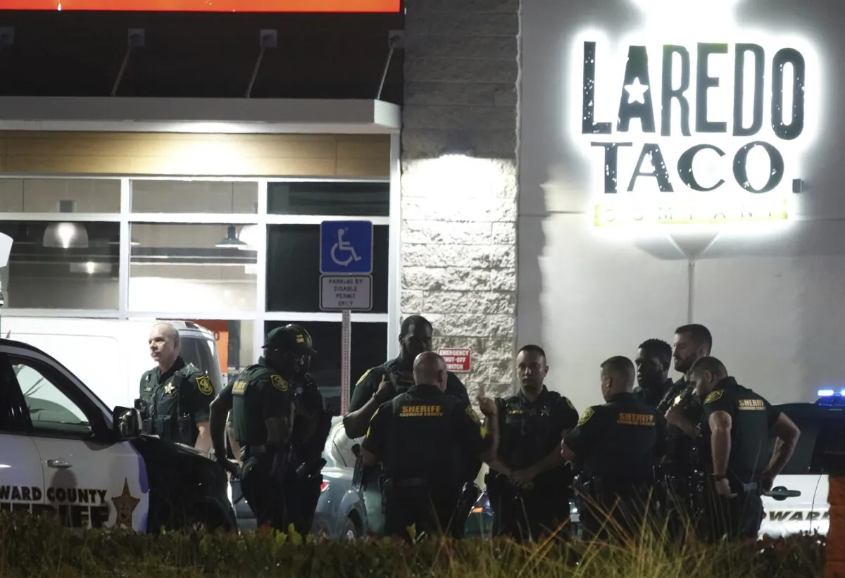 Broward Sheriff's Office Deputies work the scene of a shooting in Dania Beach, Fla., on May 5, 2023. (Joe Cavaretta/South Florida Sun-Sentinel via AP)