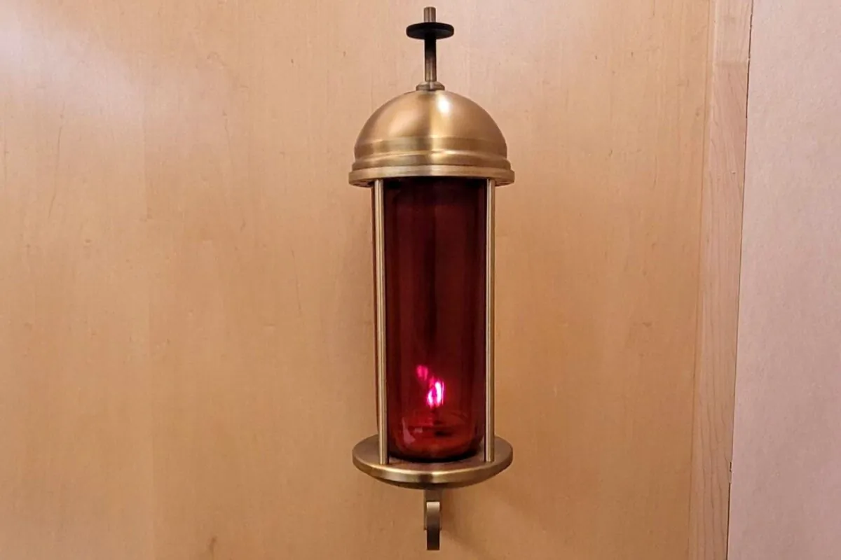 A lit candle in the chapel of Saint Francis Hospital South is at the center of a matter of religious liberty. (Saint Francis Health System.)