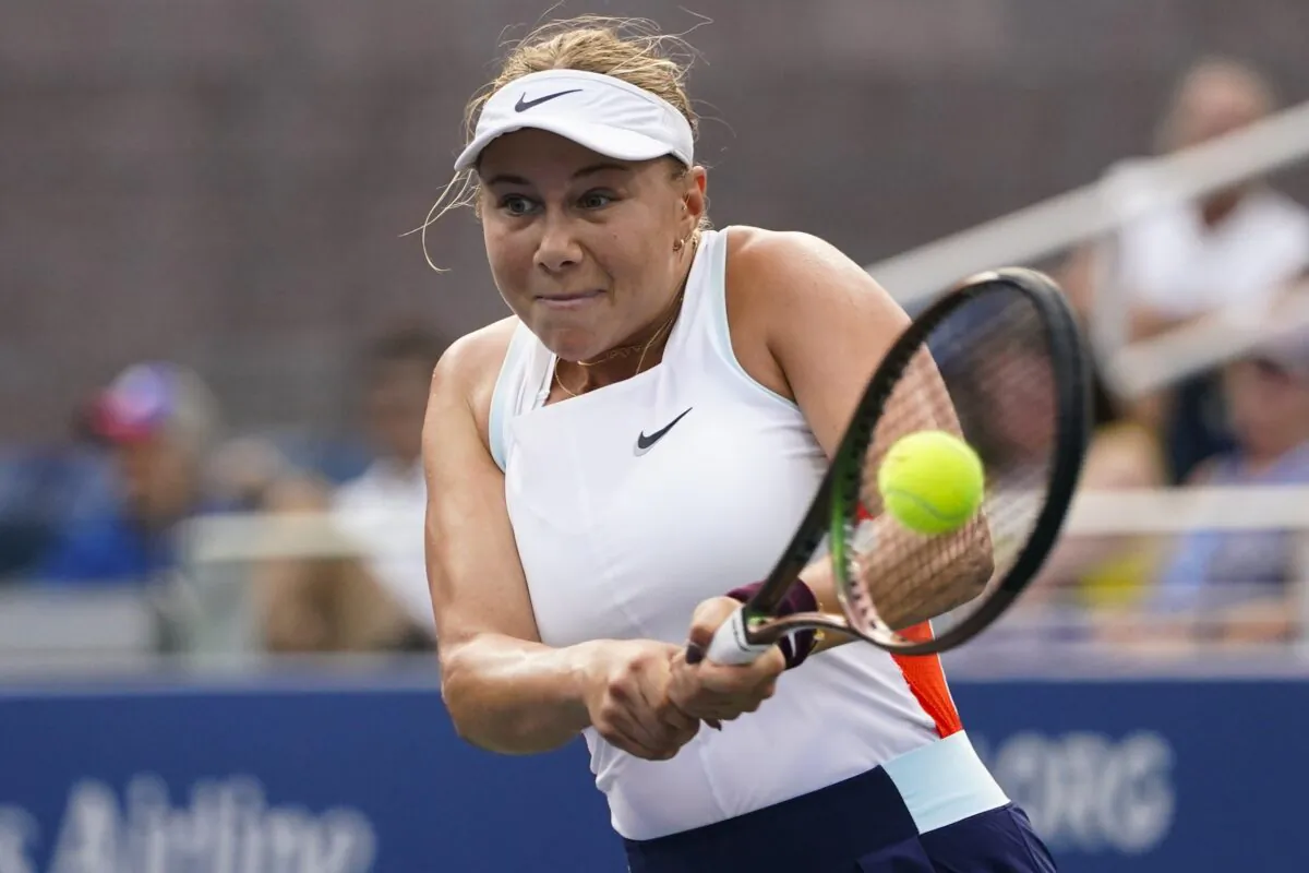 Amanda Anisimova of the United States returns a shot to Yulia Putintseva, of Kazakhstan, during the first round of the U.S. Open tennis championships in New York on Aug. 30, 2022. (Frank Franklin II/AP Photo)