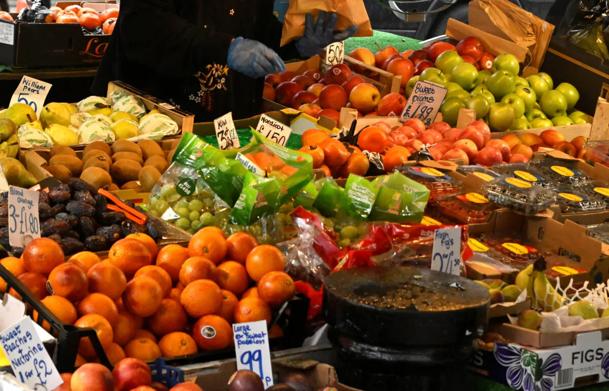 Fresh produce are displayed at a fruit and vegetable stall at Portobello Road in London, on March 31, 2023. (Toby Melville/Reuters)