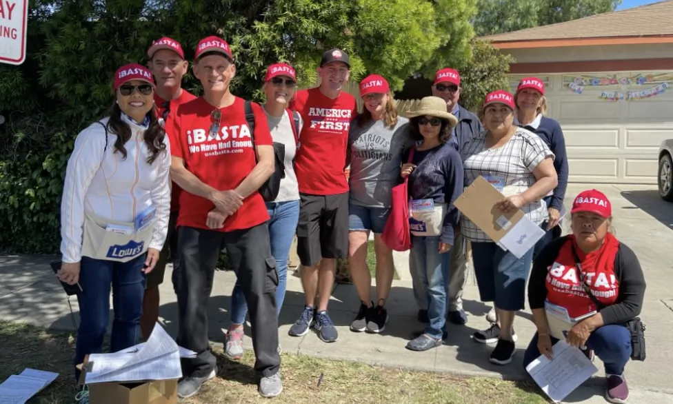 Volunteers at ¡BASTA!, a voter nonprofit based in Santa Ana with a mission to register minority voters, pose for a photo in Santa Ana, Calif. (Courtesy of Ron Flores)