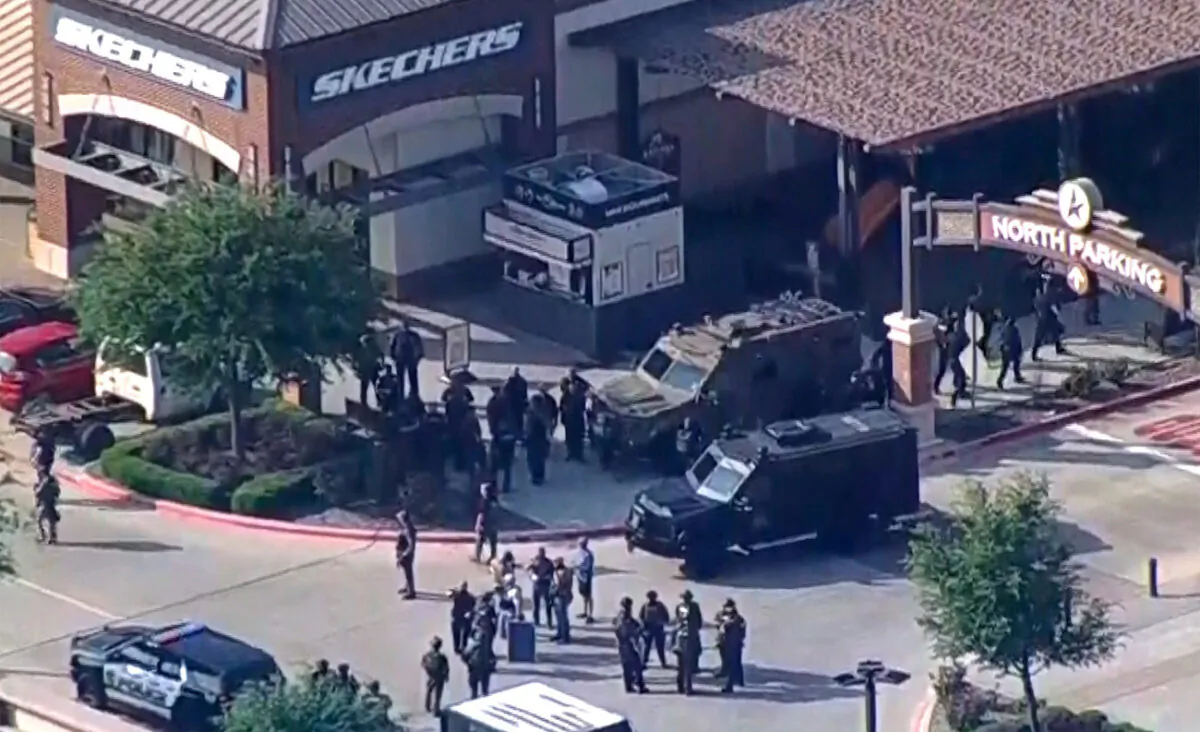 A still image from video shows police responding to a shooting in the Dallas area's Allen Premium Outlets, in Allen, Texas, on May 6, 2023. (WFAA TV via Reuters)