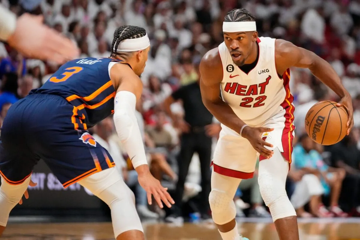 Miami Heat forward Jimmy Butler (22) looks to dribble the ball as New York Knicks guard Miles McBride (2) defends during the second half of game three of the 2023 NBA playoffs at Kaseya Center in Miami on May 6, 2023. (Rich Storry/USA TODAY Sports via Field Level Media)