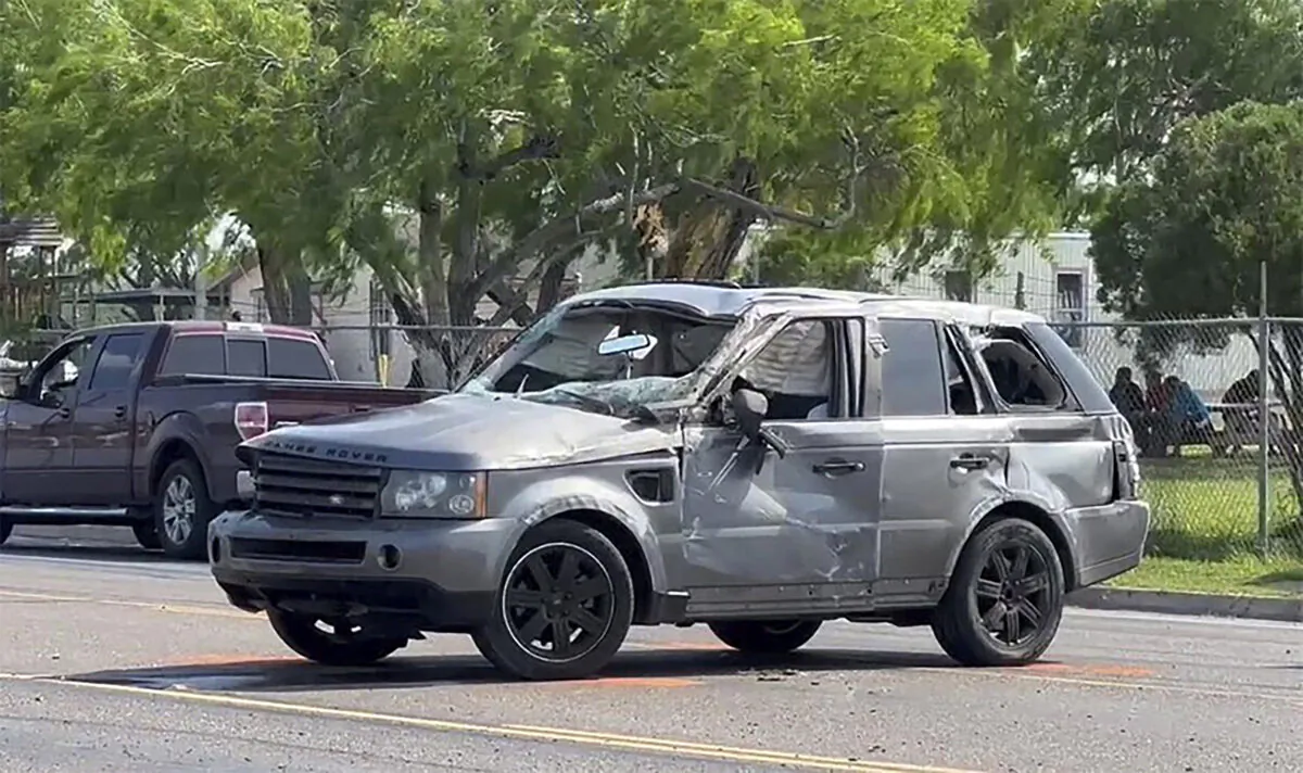 A damaged vehicle sits at the site of a deadly collision near a bus stop in Brownsville, Texas, on May 7, 2023. (Brian Svendsen/NewsNation/KVEO-TV via AP)