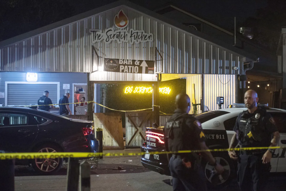 Crime scene tape surrounds The Scratch Kitchen restaurant after a shooting during a Cinco de Mayo party in Ocean Springs, Miss., on May 5, 2023. (Hannah Ruhoff/The Sun Herald via AP)