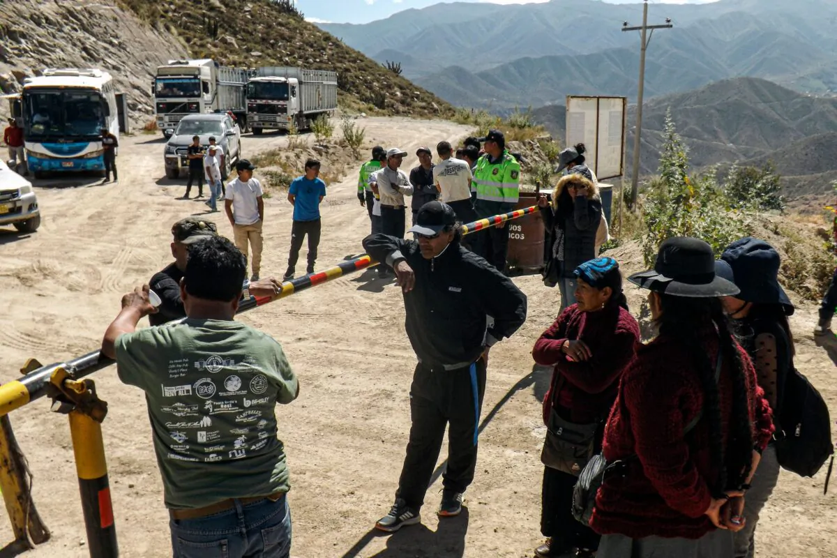 Relatives of miners wait at the entrance of the La Esperanza mine, where at least 27 people died in the Yanaquihua district of Arequipa, southern Peru, on May 7, 2023. (AFP via Getty Images)
