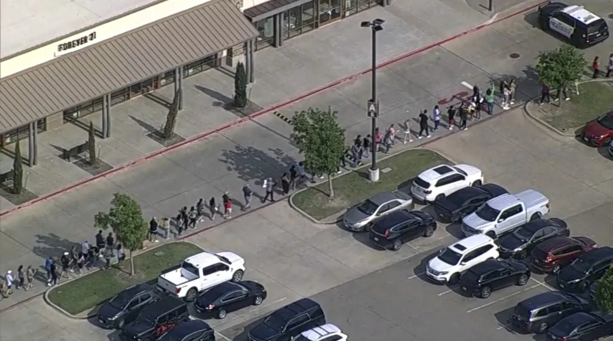 People are evacuated from Allen Premium Outlet in Allen, Texas, on May 6, 2023. (WFAA via AP)