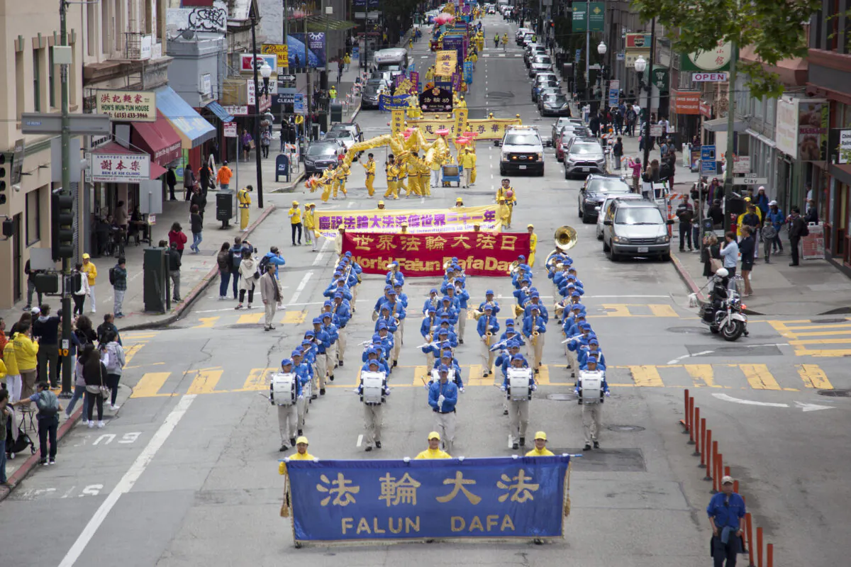 Falun Dafa practitioners march in a parade in San Francisco on May 6, 2023, to celebrate World Falun Dafa Day. (Lear Zhou/The Epoch Times)