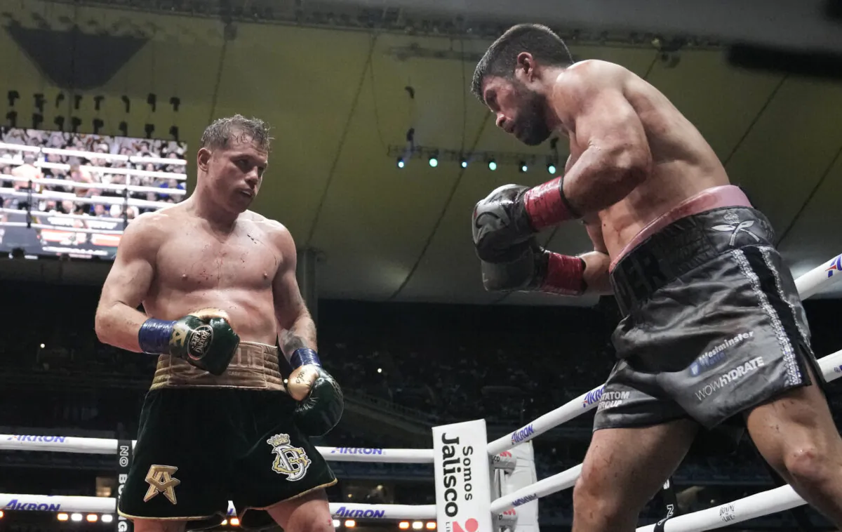 Saul "Canelo" Alvarez of Mexico, left, fights John Ryder of Britain in a super middleweight title boxing match at the Akron Stadium in Guadalajara, Mexico, on May 6, 2023. (Moises Castillo/AP Photo)