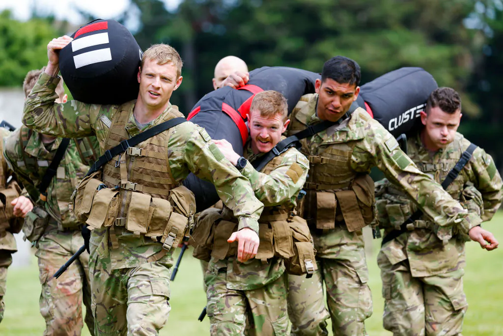 Soldiers carry 160 kilogram bags during Exercise Torokiki at Linton Military Camp in Palmerston North, New Zealand, on Nov. 25, 2022. (Hagen Hopkins/Getty Images)
