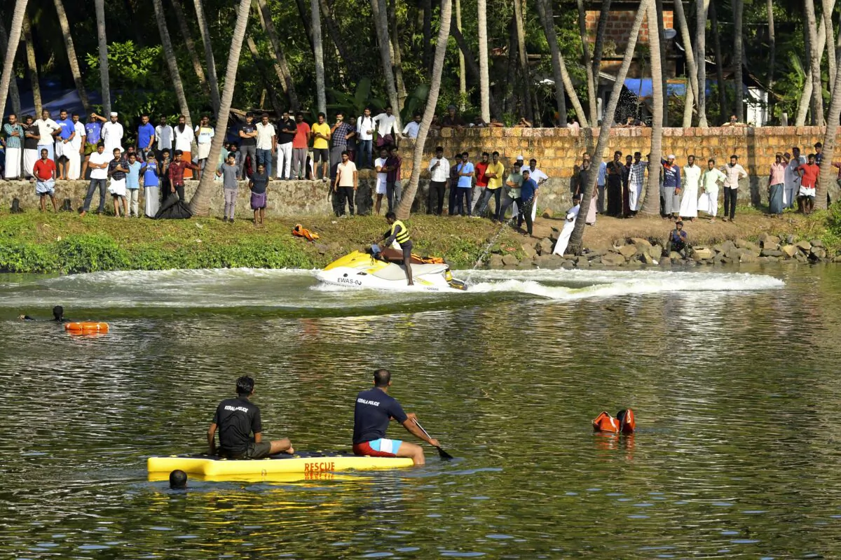 Rescuers on a boat search after a tourist boat capsized Sunday night in Malappuram, Kerala, India, on May 8, 2023. (P.P. Afthab/AP Photo)