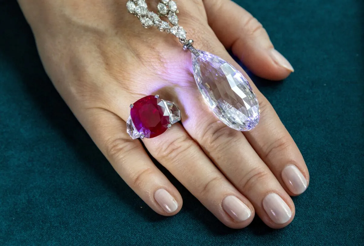 Sunrise Ruby and Diamond ring of 25 carats by Cartier and a 90-carat Briolette of India Diamond Necklace by Harry Winston during a preview of the 700-piece jewelry collection of the late Austrian billionaire Heidi Horten at Christie's before the auction sale in Geneva on May 8, 2023. (Denis Balibouse/Reuters)