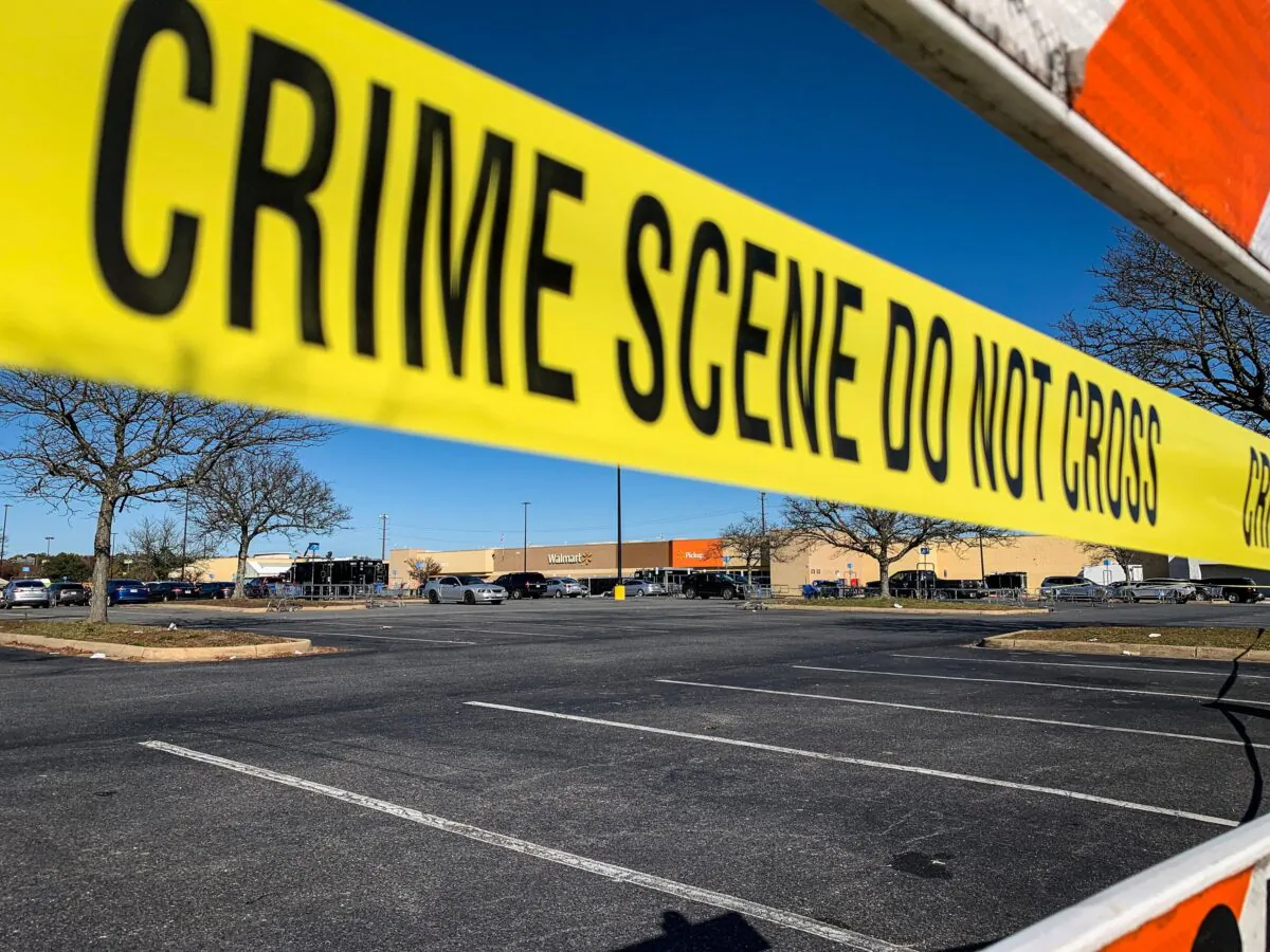 Crime scene tape blocks the parking lot outside of a Walmart following a mass shooting the night before in Chesapeake, Va., on Nov. 23, 2022. (Bastien Inzaurralde/AFP via Getty Images)