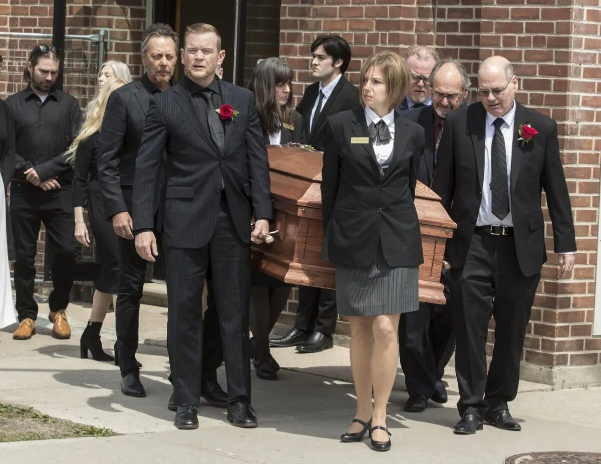 Family members carry the casket of singer-songwriter Gordon Lightfoot after a funeral service at St. Paul's United Church, in his hometown of Orillia, Ont., May 8, 2023. (The Canadian Press/Fred Thornhill)