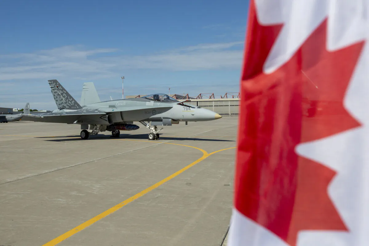 A CF-18 Hornet sits on the tarmac at Canadian Forces Base Trenton, in Trenton, Ont., on June 20, 2022. (Lars Hagberg/The Canadian Press)