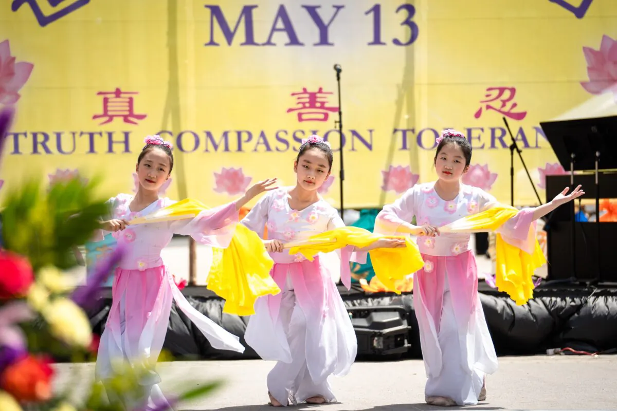 Falun Gong practitioners celebrate World Falun Dafa Day in New York City on May 7, 2023. (Samira Bouaou/The Epoch Times)