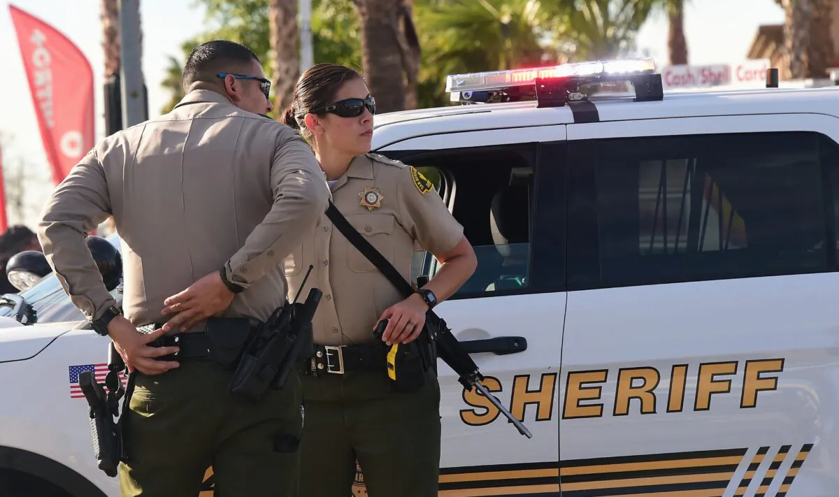 Officers from the Sheriff's department patrol near the scene of a crime in San Bernardino, Calif., on Dec. 2, 2015. (Frederic J. Brown/AFP via Getty Images)