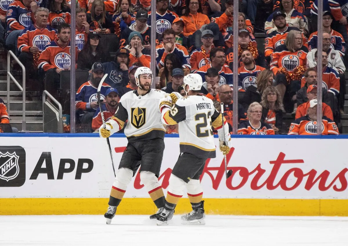 Vegas Golden Knights' Nicolas Roy (10) and Alec Martinez (23) celebrate after a goal against the Edmonton Oilers during second-period NHL hockey Stanley Cup second-round playoff game action in Edmonton, Alberta, Canada, on May 8, 2023. (Jason Franson/The Canadian Press via AP)