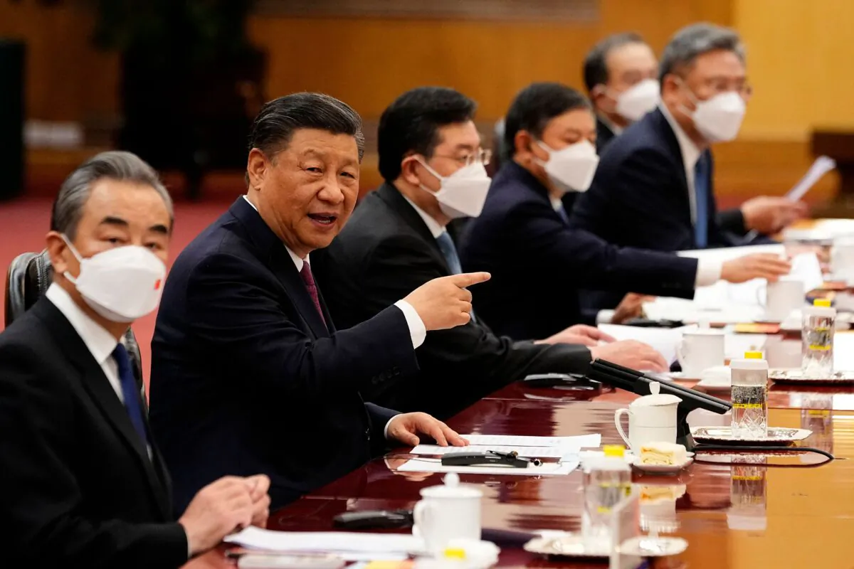 Chinese Communist Party’s leader Xi Jinping (2nd L) attends a meeting with Gabon's President Ali Bongo Ondimba at the Great Hall of the People in Beijing on April 19, 2023. (Ken Ishii/AFP via Getty Images)