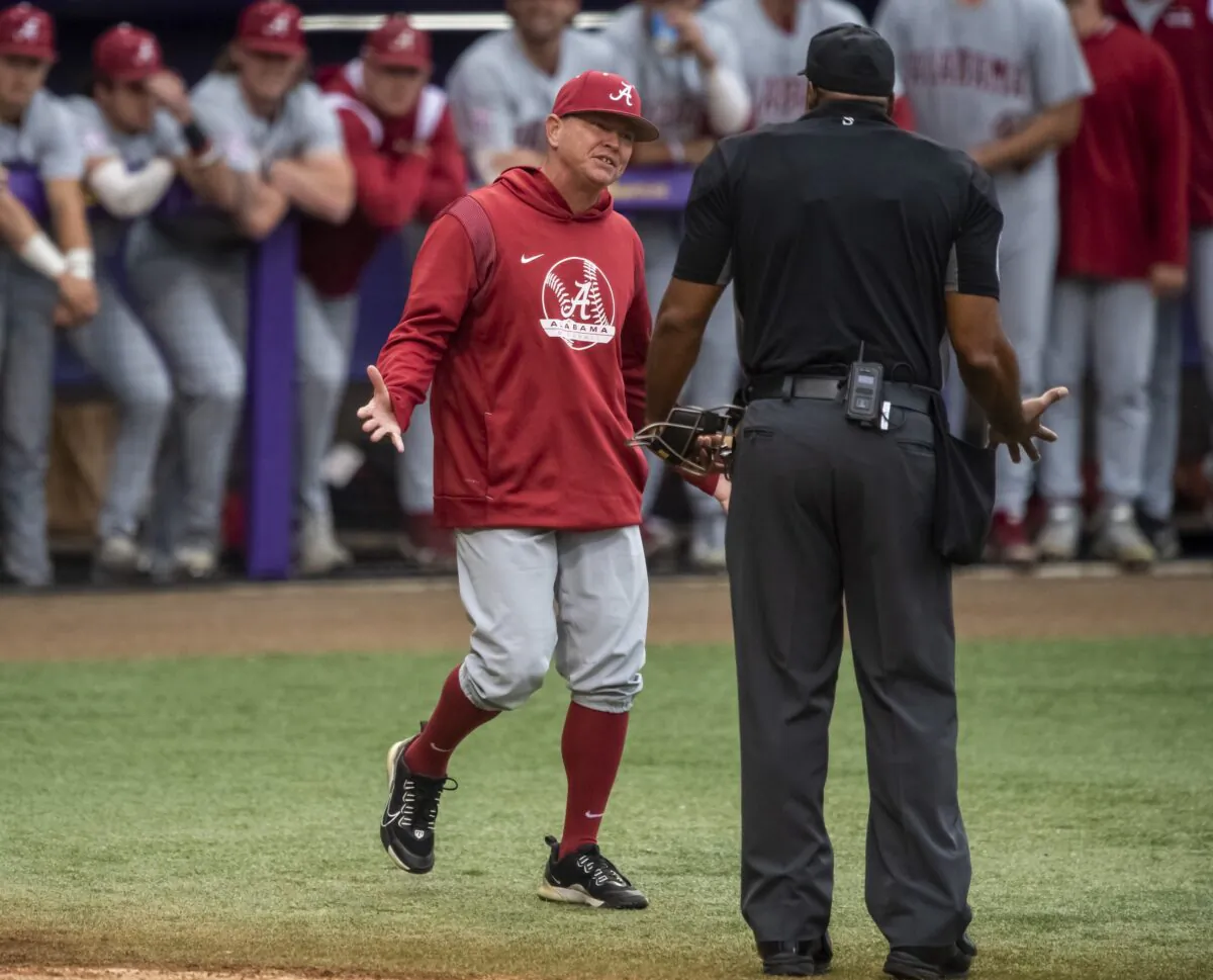 Alabama head coach Brad Bohannon (L) argues with umpire Joe Harris after being tossed from an NCAA college baseball game in the bottom of the second inning against LSU in Baton Rouge, La., on April 29, 2023. (Michael Johnson/The Advocate via AP)