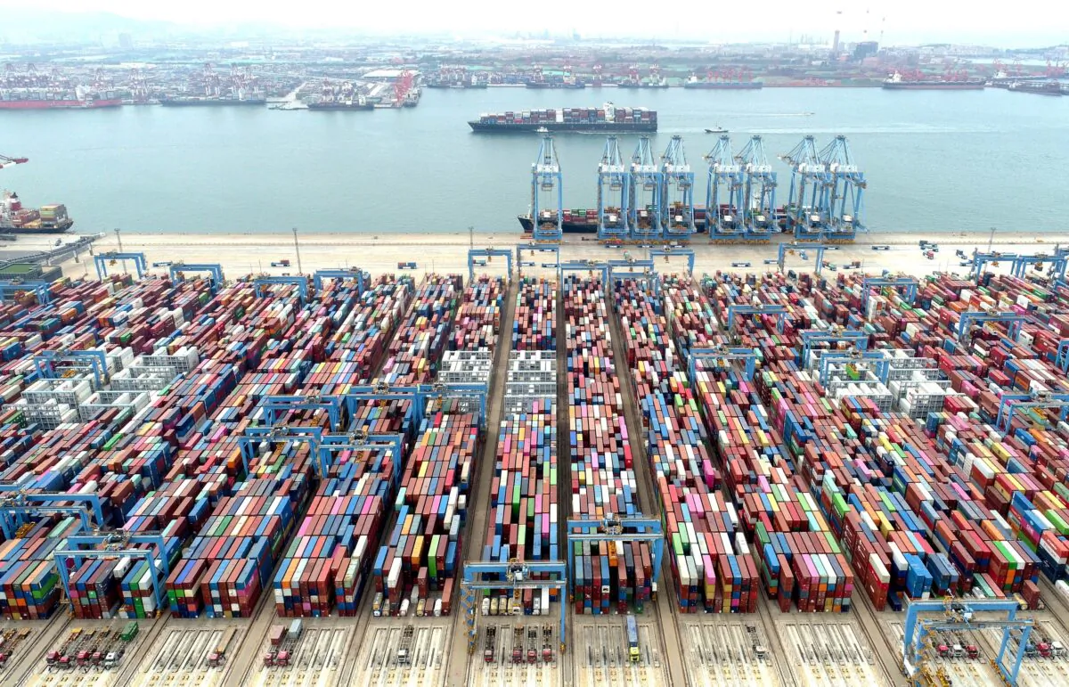 Containers and cargo vessels at the Qingdao port in Shandong province, China, on May 9, 2022. (China Daily via Reuters)