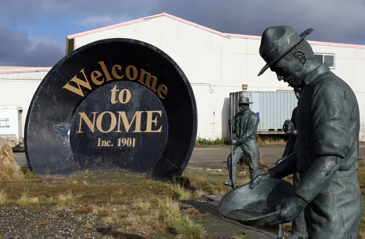 A giant gold pan welcomes visitors to Nome, Alaska, on Sept. 29, 2006. The discovery of gold by Norwegian Jafet Lindeberg and Swedes Erik Lindblom and John Brynteson in 1898 in nearby Anvil Creek led to the founding of Anvil City, later renamed Nome. (Gabriel Bouys/AFP via Getty Images)
