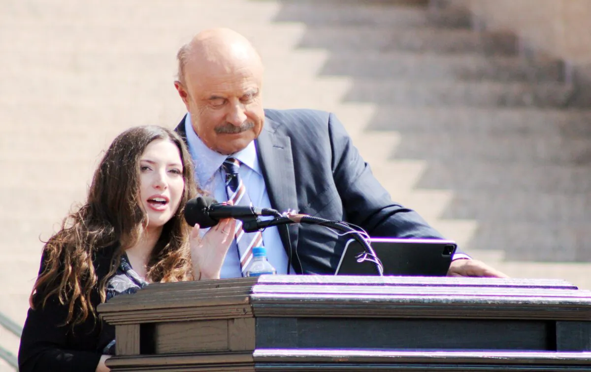 Lea Glossip, wife of Oklahoma death row inmate Richard Glossip and television personality Dr. Phil McGraw address a May 9, 2023, rally for Glossip at the state capitol in Oklahoma City. (Michael Clements/The Epoch Times)