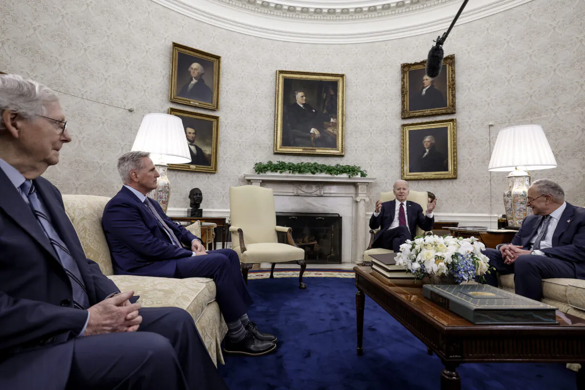 Senate Minority Leader Mitch McConnell (R-Ky.), House Speaker Kevin McCarthy (R-Calif.), and President Joe Biden meet with other lawmakers in the Oval Office of the White House in Washington on May 9, 2023. (Anna Moneymaker/Getty Images)
