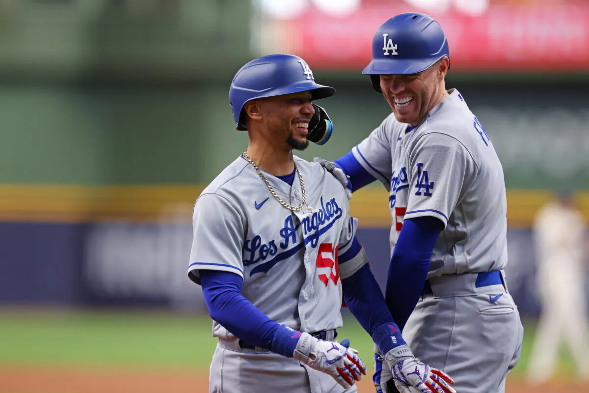 Mookie Betts (50) of the Los Angeles Dodgers is congratulated by Freddie Freeman (5) following a home run against the Milwaukee Brewers during the first inning at American Family Field in Milwaukee on May 9, 2023. (Stacy Revere/Getty Images)
