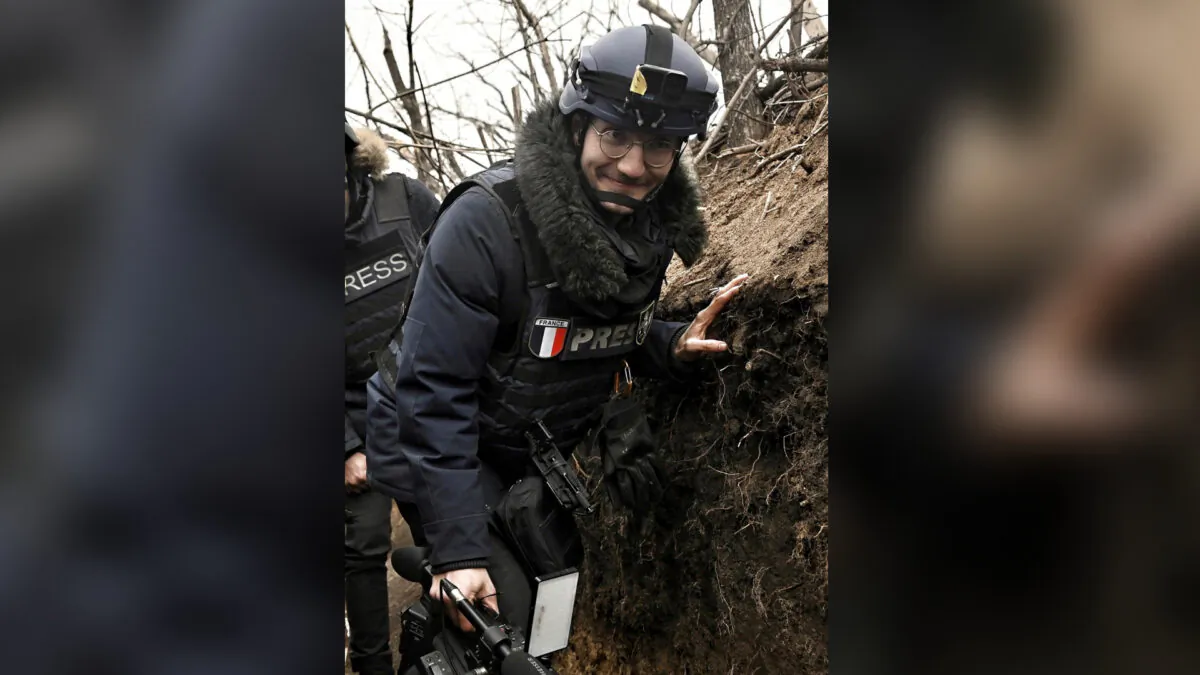 AFP journalist Arman Soldin walks in a trench as he covers the war in Ukraine, on March 18, 2023. (Aris Messinis/AFP via AP)
