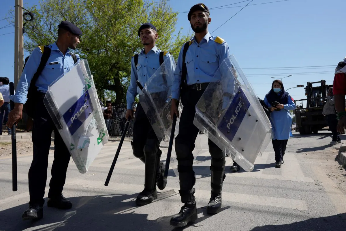Police officers stand guard to ensure security at the vicinity of police headquarters, where Pakistan's former Prime Minister Imran Khan is held and will appear in a temporary court set up by authorities for security reasons, in Islamabad, Pakistan, on May 10, 2023. (Anjum Naveed/AP Photo)