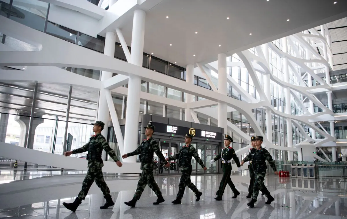 Chinese paramilitary police march inside the newly opened Daxing International Airport in Beijing on Sept. 28, 2019. (Noel Celis/AFP via Getty Images)