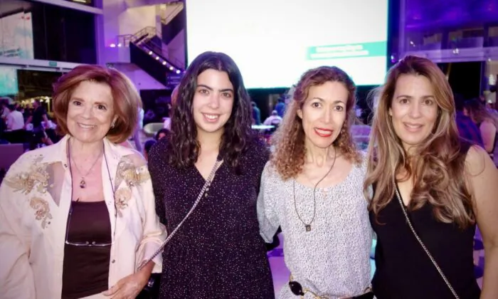 Leticia Valencia (2nd-R) enjoyed Shen Yun with her family in Mexico City on May 9, 2023. (Lily Yu/The Epoch Times)