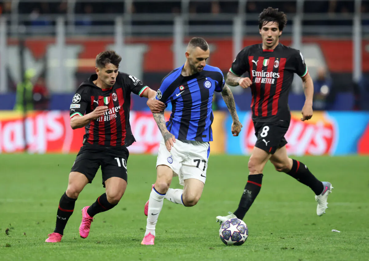 AC Milan's Brahim Diaz and Sandro Tonali in action with Inter Milan's Marcelo Brozovic during the Champions League Semi Final First Leg - AC Milan v Inter Milan soccer match at San Siro in Milan on May 10, 2023. (Claudia Greco/Reuters)