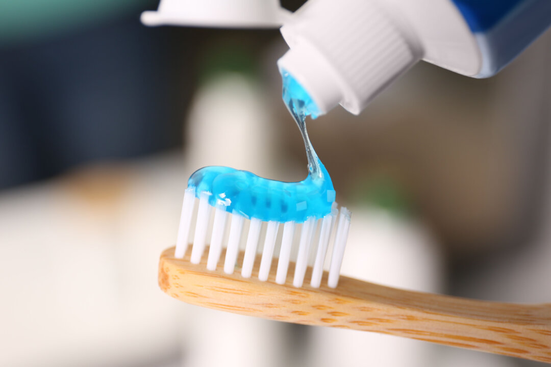 Authors of the ATSDR report warn that swallowing toothpaste can account for a large percentage of fluoride exposure for children under 8 years old. (New Africa/Shutterstock)