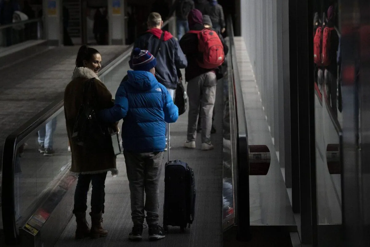 People make their way through Pearson Airport in Mississauga, Ont., on March 14, 2023. (The Canadian Press/Chris Young)

