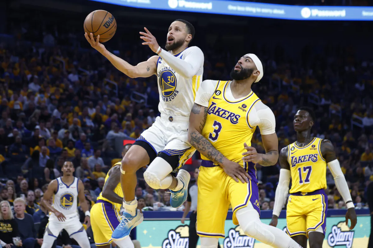 Golden State Warriors guard Stephen Curry (30) drives toward the basket as Los Angeles Lakers center Anthony Davis (3) defends during the second quarter of Game 5 in a second-round NBA basketball playoff series in San Francisco on May 10, 2023. (Stephen Lam/San Francisco Chronicle via AP)