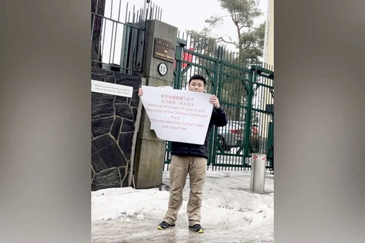Zhao Yunting protests against the Chinese regime’s tyranny in front of the Chinese Embassy in Helsinki, Finland, in March 2023. (Courtesy of Zhao Yunting) 