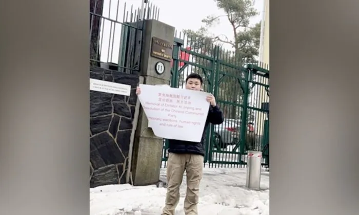 Zhao Yunting protests against the Chinese regime’s tyranny in front of the Chinese Embassy in Helsinki, Finland, in March 2023. (Courtesy of Zhao Yunting) 